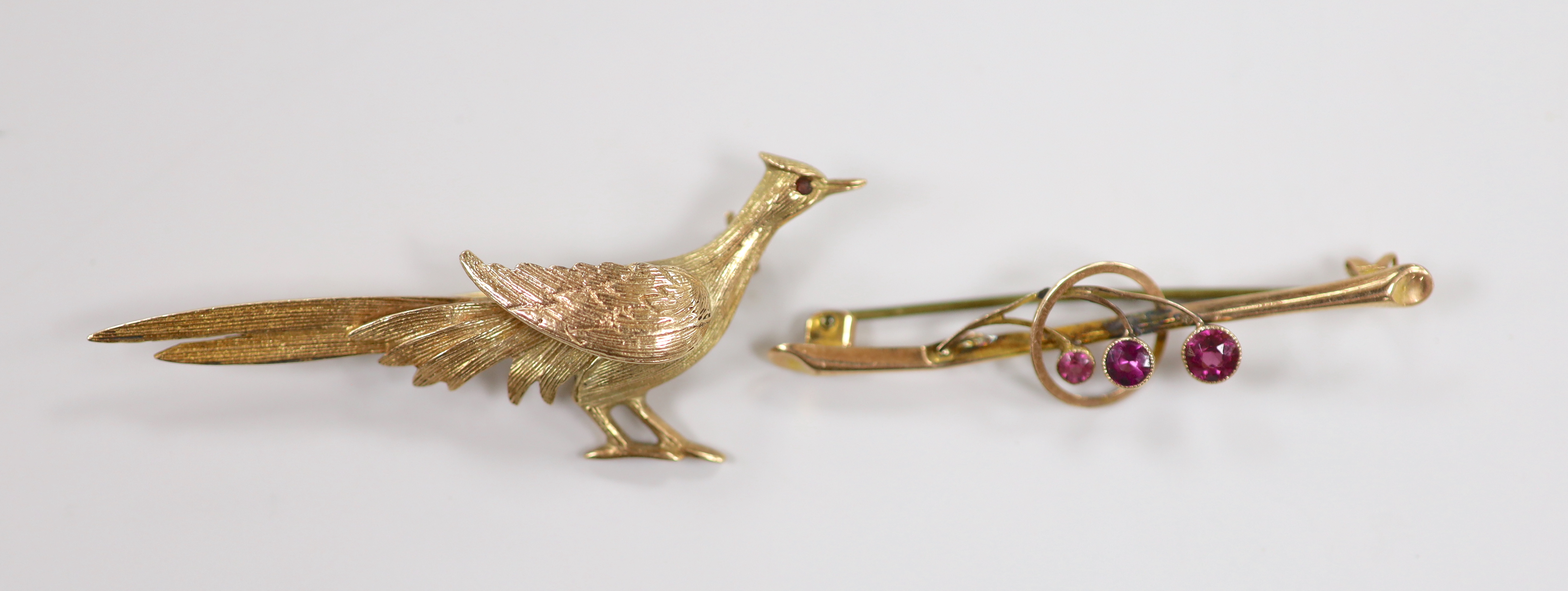 A 1960's 9ct gold pheasant brooch, 60mm and an earlier 9ct and gem set bar brooch, gross weight 7.3 grams.